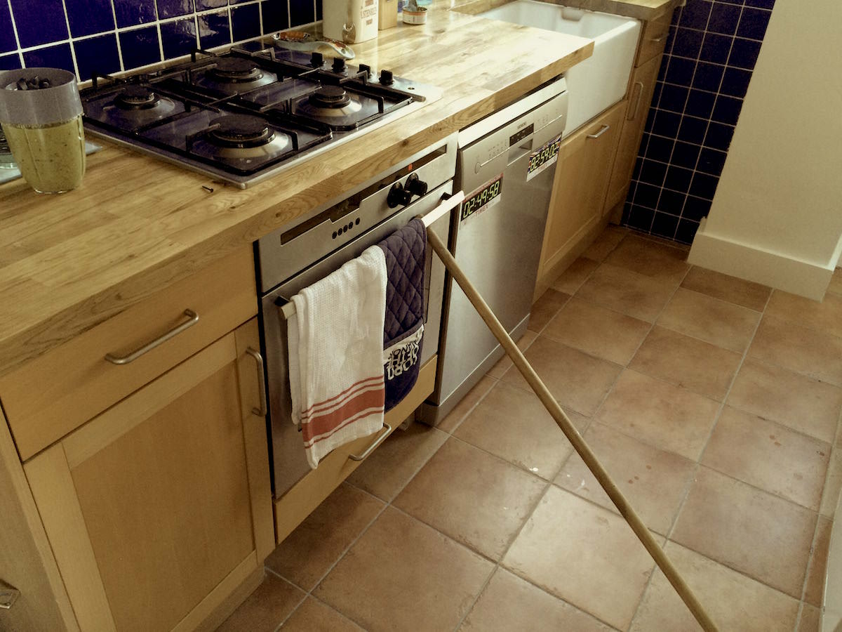 Our old oven door needs the help of a broom stick to keep the warmth in - essential for baking cakes!